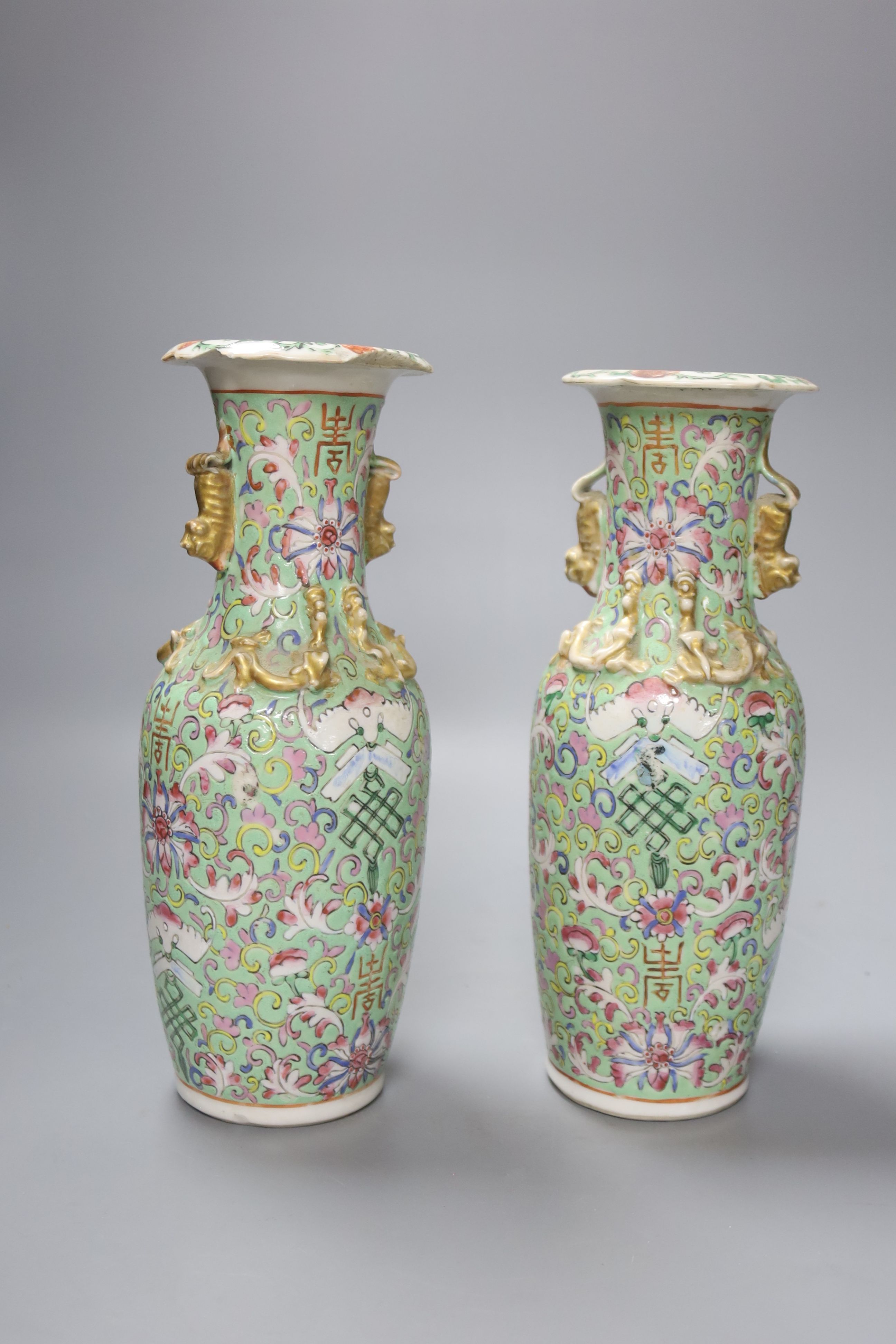 A pair of late 19th century Chinese famille rose vases, height 26cm